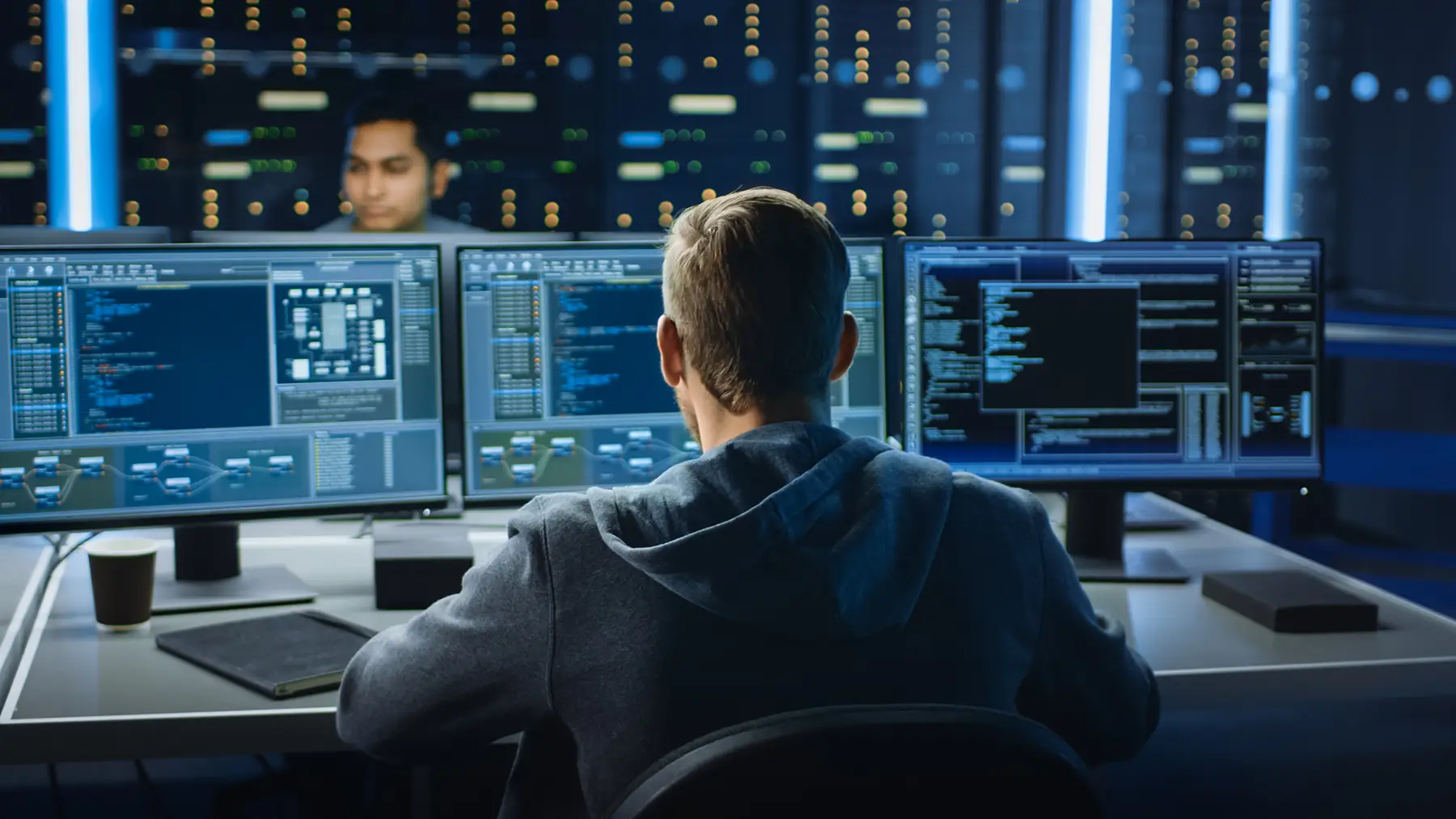 Sage ISG worker on the computer checking codes