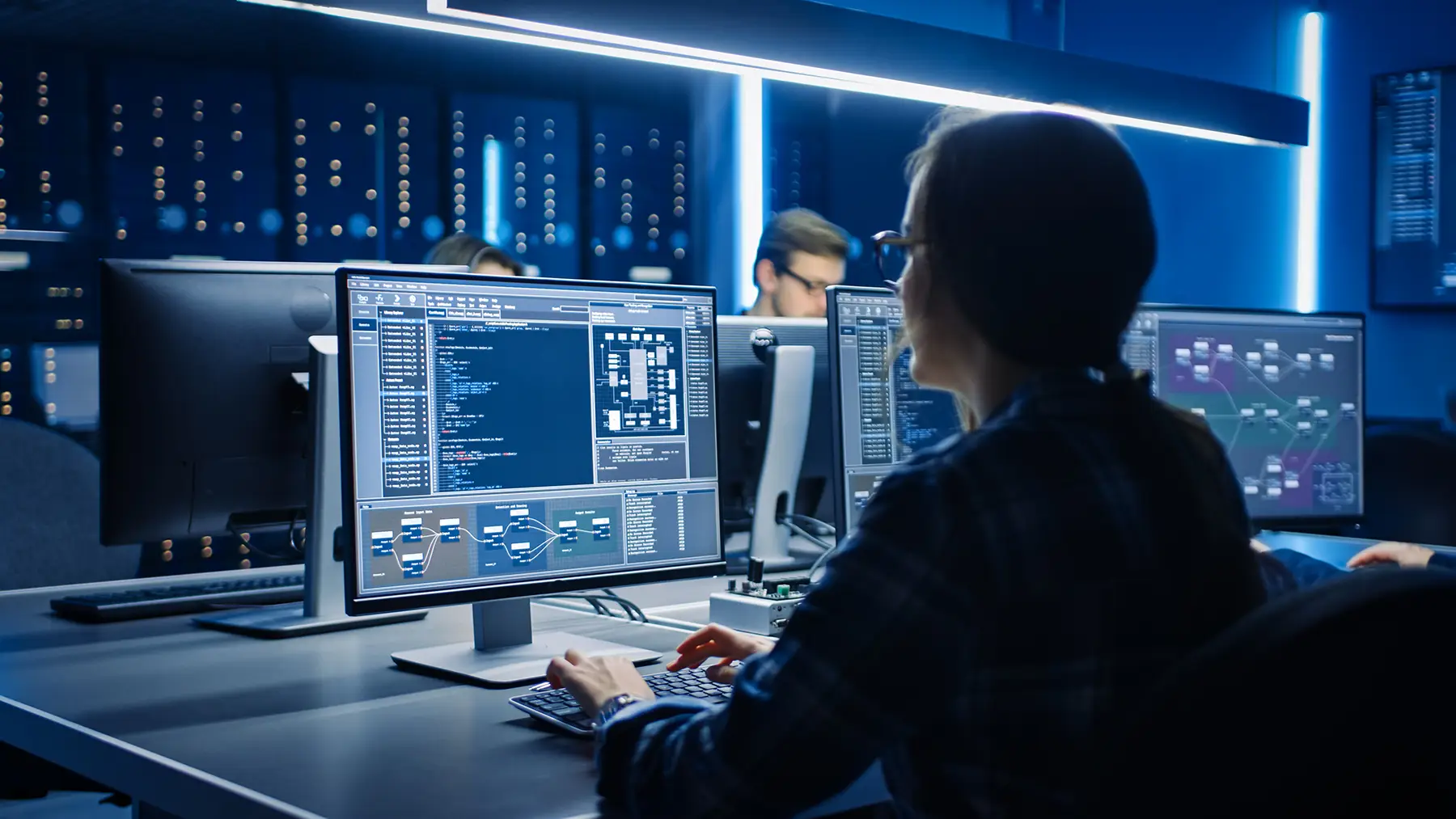 Sage ISG worker on the computer coding